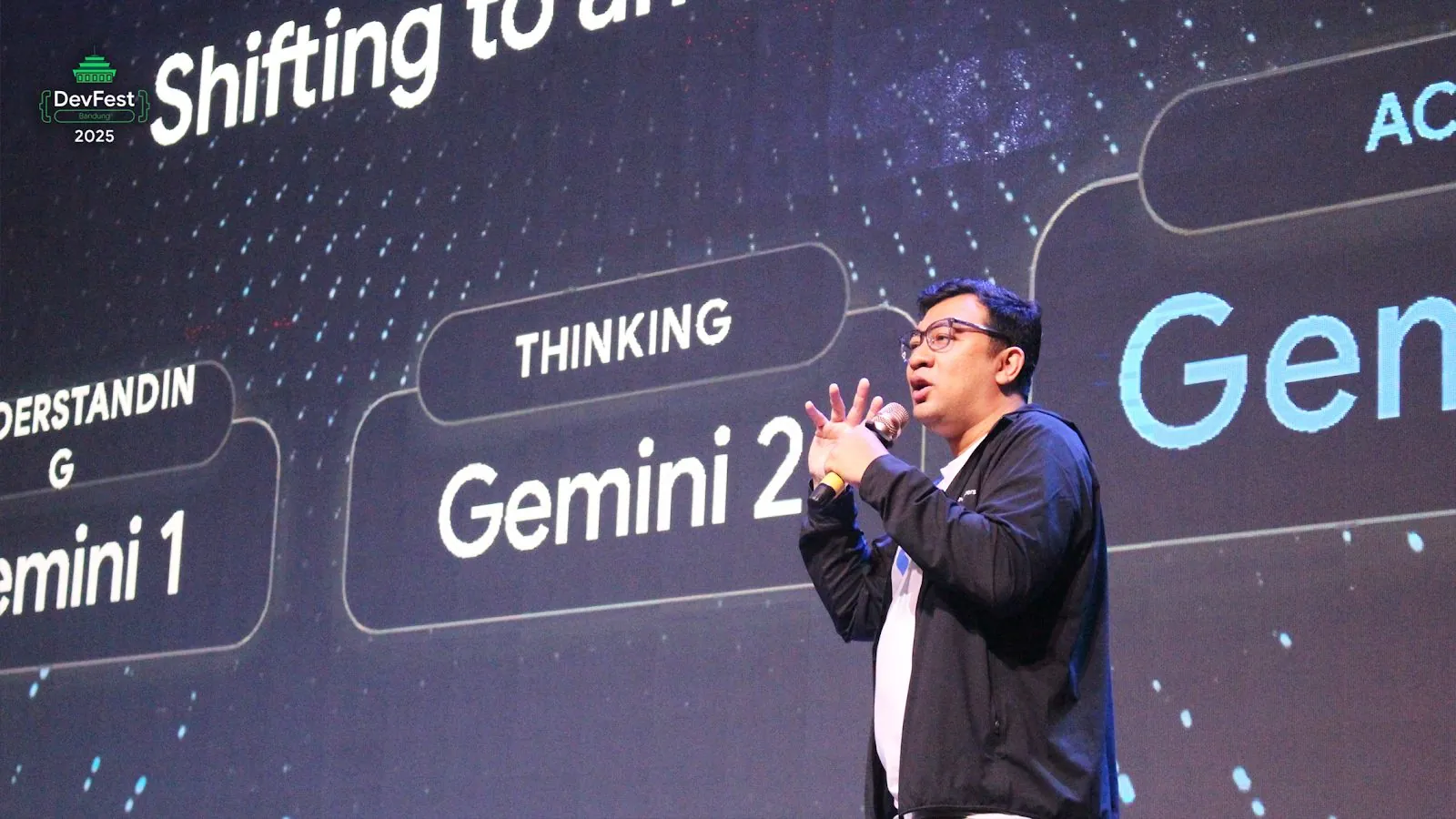 A speaker presenting on the DevFest Bandung 2025 main stage